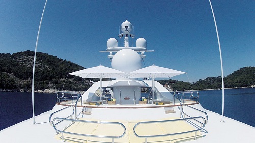 refined selection of white sun shading parasols on yacht